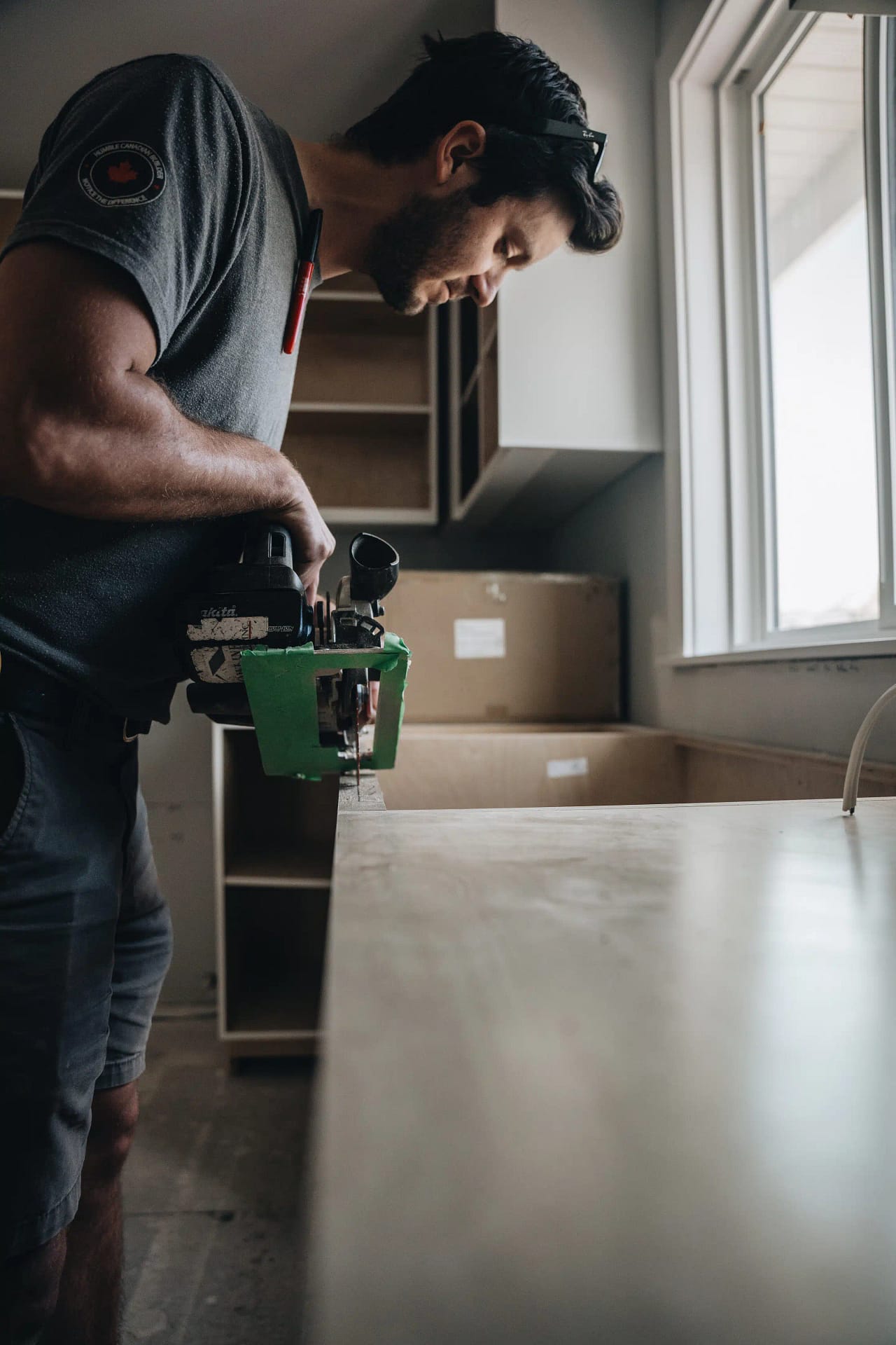 Contractor installing kitchen countertops by Bowline Construction in Langley, BC