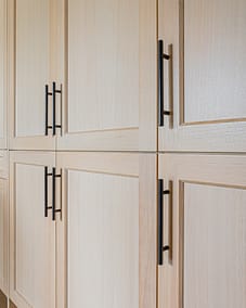 Newly constructed custom addition brown cabinet with brown handles