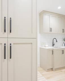 A picture of a white wooden kitchen cabinet with custom additions in Langley, BC