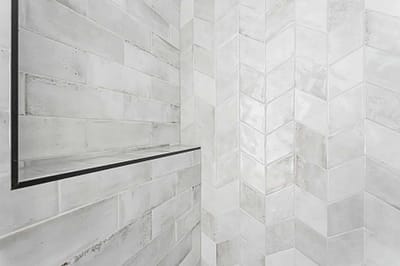 A white tile made by home renovation contractors in Langley, BC
