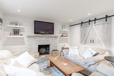 An image of a living room with large sofas that is made by home renovation contractors in Langley, BC
