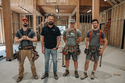 Bowline Construction pole barn construction team members inside a pole barn under construction in Langley, BC