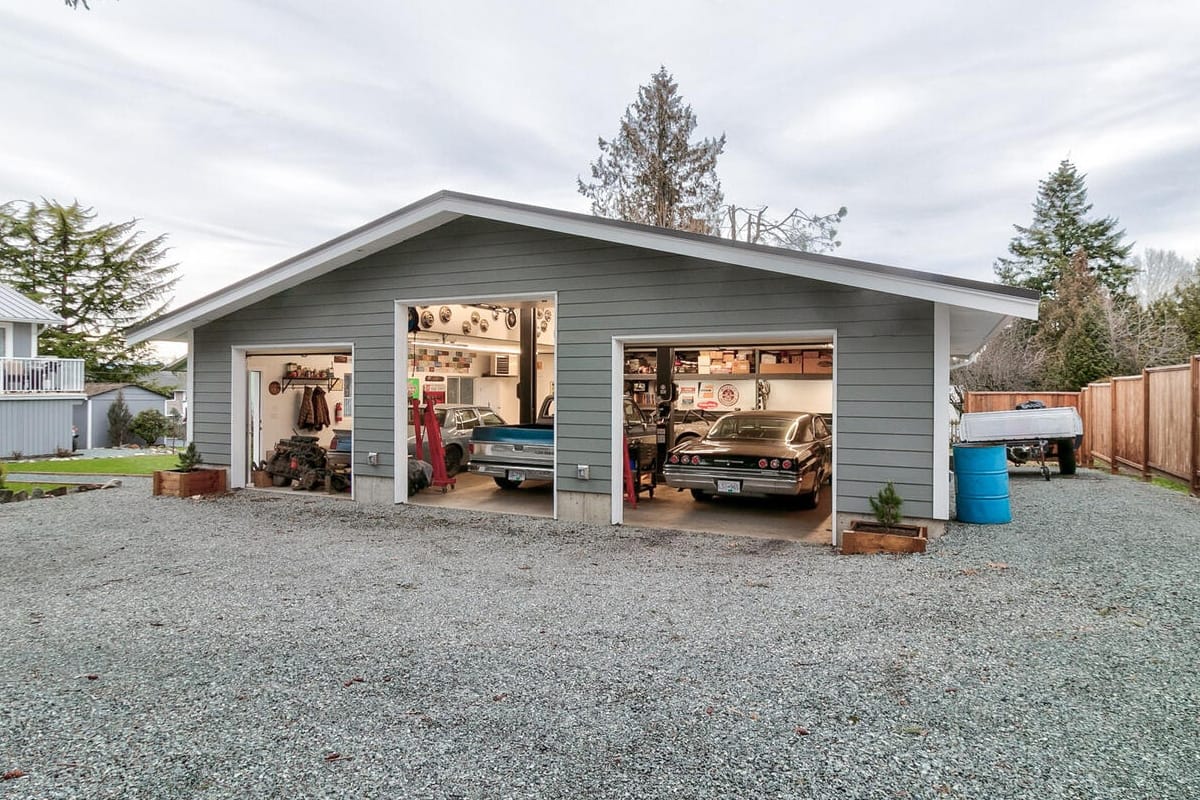 custom wooden storage shop garage shed with camper and golf cart inside