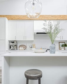 A white accent kitchen with modern industrial kitchen equipment by kitchen renovation contractor in Langley, BC