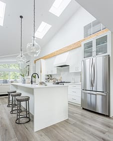 A white accent kitchen with modern industrial kitchen equipment by kitchen renovation contractor in Langley, BC
