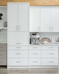 A white accent kitchen with modern industrial kitchen equipment by kitchen renovation contractor in Langley, BC