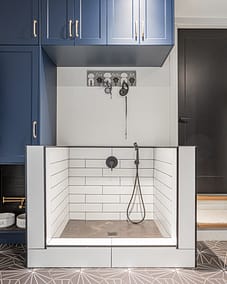 A well-organized pet washing station in a laundry room or mudroom.