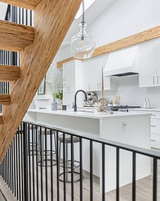 A white accent kitchen with modern industrial kitchen equipment by kitchen renovation contractor in Langley, BC