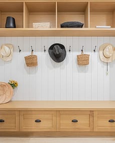 A custom designed wooden shelves and hats on hook with custom additions in Langley, BC