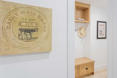 An image of a picture frame of a cow with wooden shelves and tabletop that has custom additions in Langley, BC