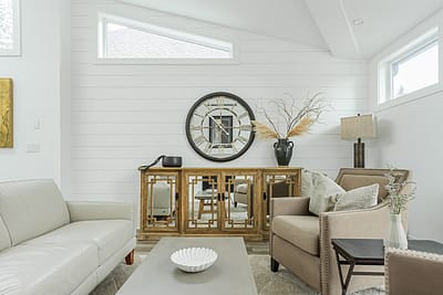 A white accent living room with modern design by design-build contractors in Langley, BC