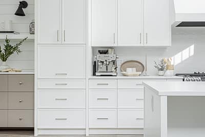 A white accent kitchen with modern industrial kitchen equipment by kitchen renovation contractor in Langley, BC