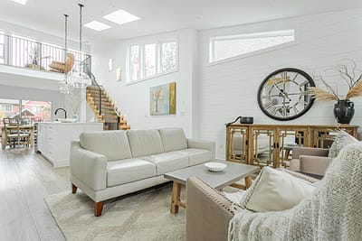 A white accent living room with modern design by design-build contractors in Langley, BC