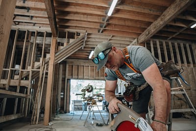Bowline Construction team member in a process of pole barn construction in Langley, BC