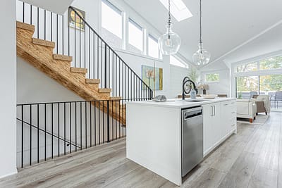 A white accent kitchen with modern industrial kitchen equipment by kitchen renovation contractor in Langley, BC