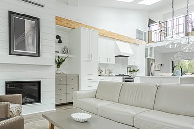 A white accent living room with modern design by design-build contractors in Langley, BC