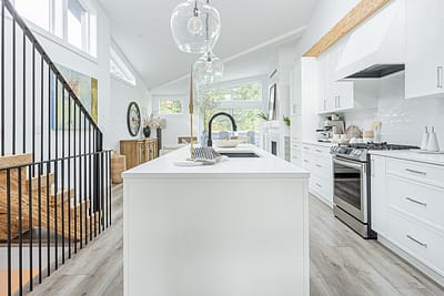 A white accent kitchen with modern industrial kitchen equipment by kitchen renovation contractor in Langley, BC