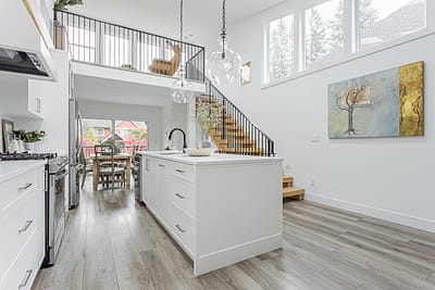 A white accent kitchen with modern industrial kitchen equipment by kitchen renovation contractor in Langley, BC