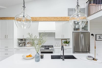 A white accent kitchen with modern industrial kitchen equipment by kitchen renovation contractor in Langley, BC