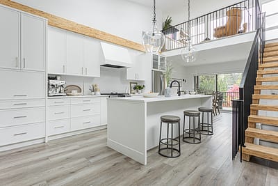 A white accent kitchen with modern industrial kitchen equipment by kitchen renovation contractor in Langley, BC