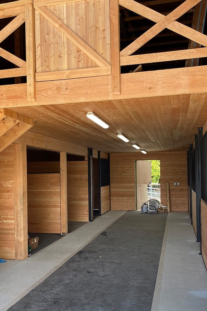 A newly constructed barn showcasing traditional wooden design. An example of agricultural buildings in Langley, BC