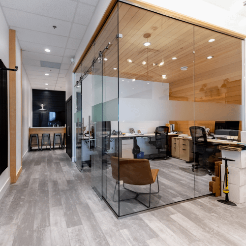 Open office with glass walls and meeting area built by Bowline Construction in Langley, BC