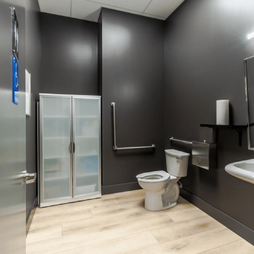 Modern accessible restroom with wood finishes built by Bowline Construction in Langley, BC