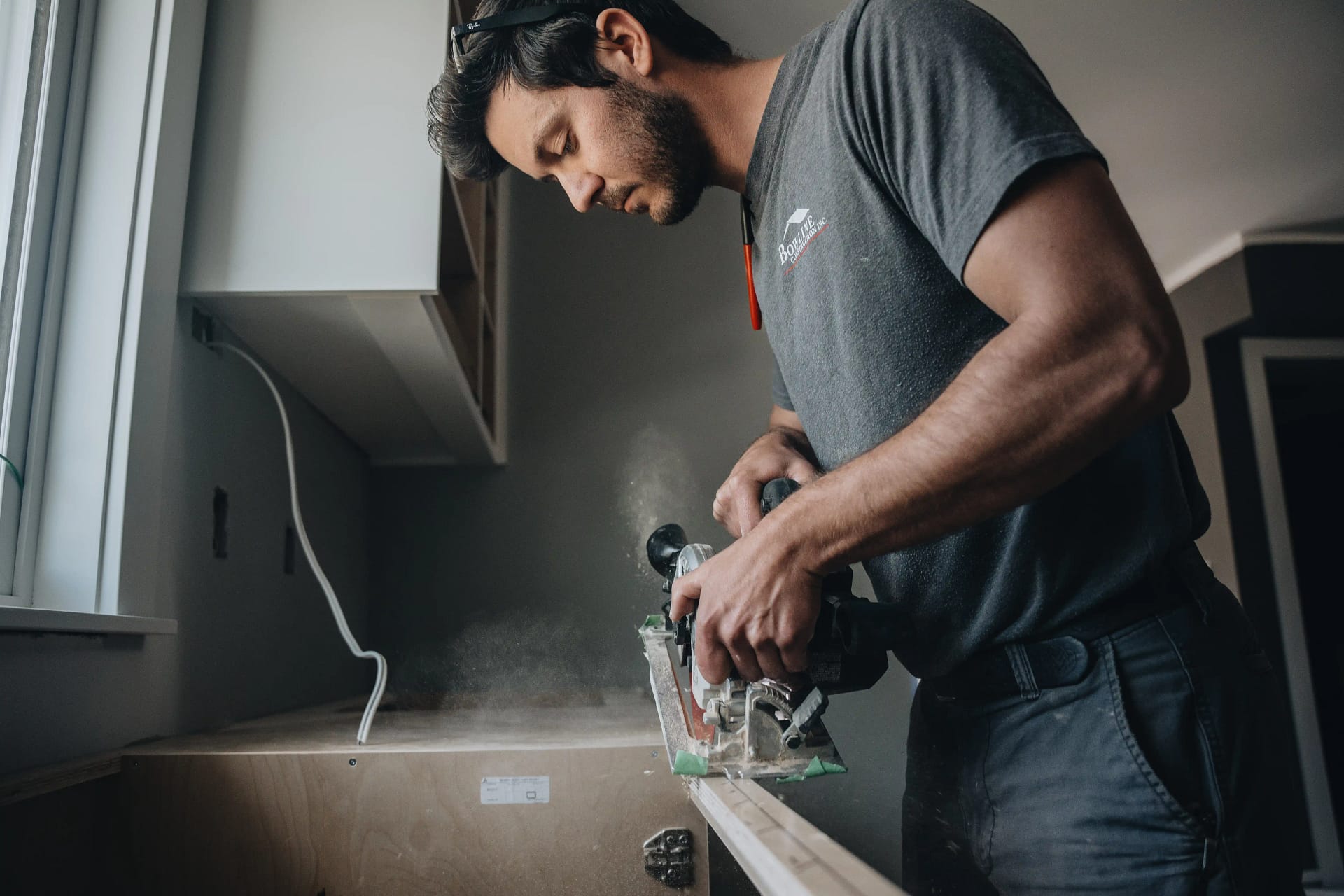 Finish carpentry in progress by Bowline Construction in Langley, BC Bowline Construction craftsman uses a circular saw for finish carpentry detail on a custom home project in Langley, BC